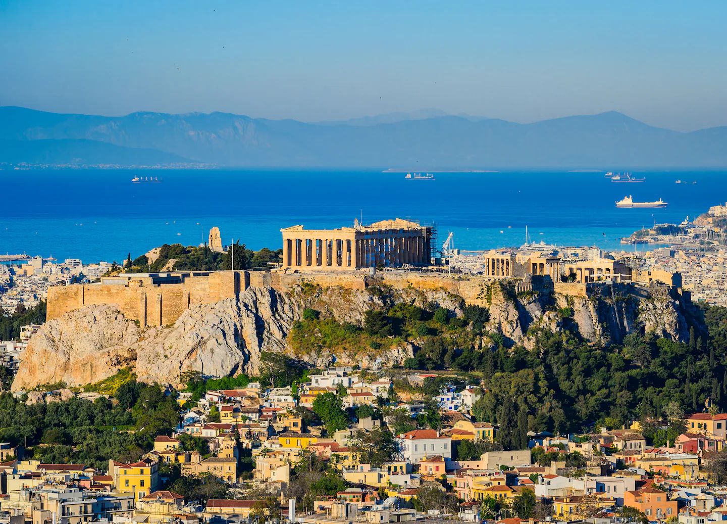 The Acropolis of Athens seen from across the city, with the sea beyond